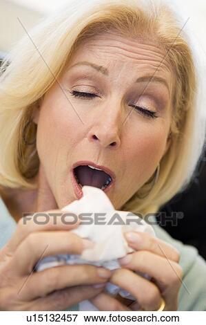Stock Photo - Senior Woman Sneezing. Fotosearch