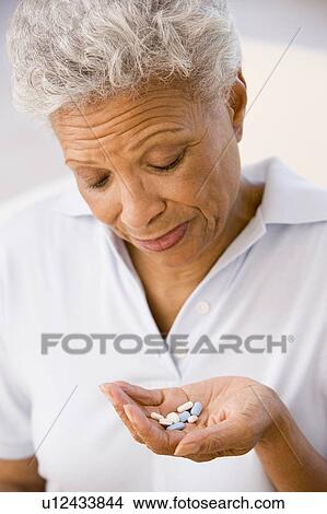 Woman Taking Pills View Large Photo Image Picture - Woman Taking Pills. Fotosearch