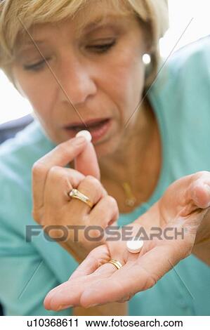 Woman Taking Pills View Large Photo Image Stock Image - Woman Taking Pills. Fotosearch
