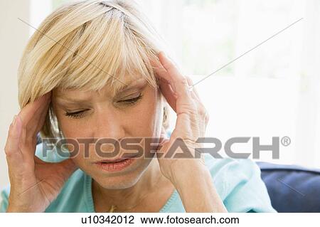 Stock Image - Woman With A Headache. Fotosearch