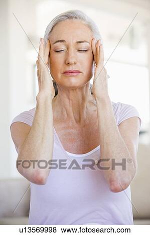 Stock Photo - Woman With A Headache. Fotosearch