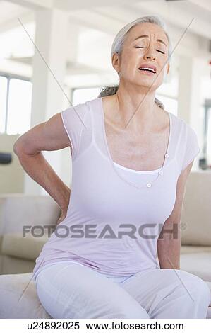 Woman With Back Pain View Large Photo Image Stock Photography - Woman With Back Pain. Fotosearch