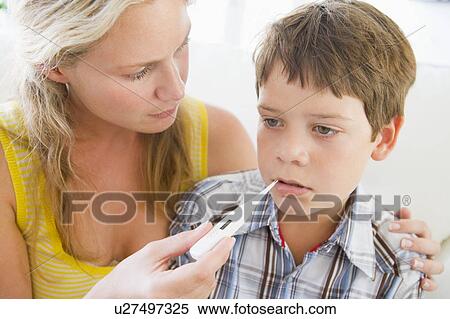 Boy Having His Temperature Measured View Large Photo Image Stock Photography - Boy Having His Temperature Measured. Fotosearch