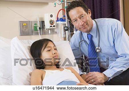 Picture - Doctor Checking Up On His Patient. Fotosearch