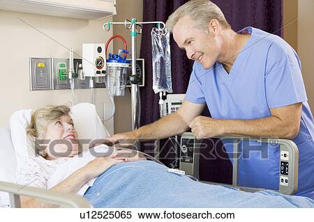 Stock Photography - Doctor Checking Up On Patient. Fotosearch