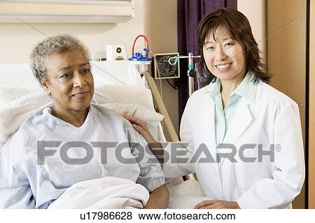 Doctor Talking To Patient View Large Photo Image Stock Photo - Doctor Talking To Patient. Fotosearch