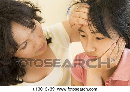Stock Photo - Girl Having Her Temperature Measured. Fotosearch