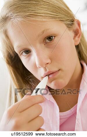 Girl Having Her Temperature Measured View Large Photo Image Stock Photo - Girl Having Her Temperature Measured. Fotosearch
