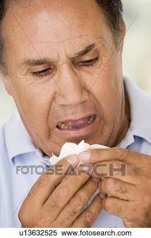 Stock Photography - Man Blowing His Nose. Fotosearch