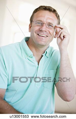 Man Looking Through New Glasses View Large Photo Image Stock Image - Man Looking Through New Glasses. Fotosearch