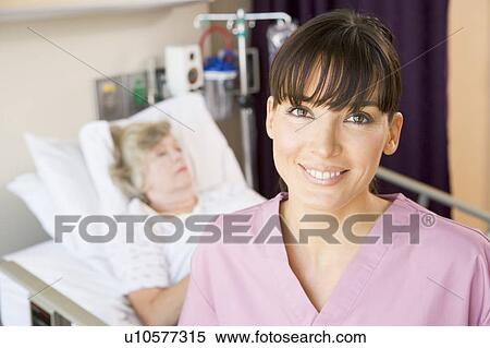 Nurse Standing In Hospital Room, Smiling View Large Photo Image Stock Photography - Nurse Standing In Hospital Room, Smiling. Fotosearch