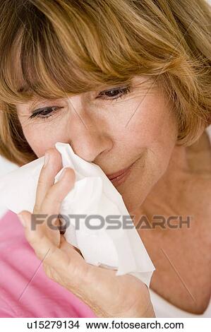Woman Blowing Her Nose View Large Photo Image Picture - Woman Blowing Her Nose. Fotosearch