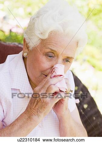 Picture - Woman Blowing Her Nose. Fotosearch