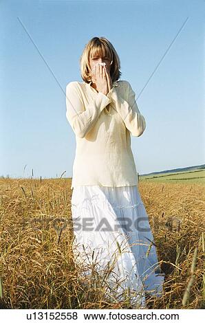 Stock Photo - Woman Blowing Her Nose. Fotosearch