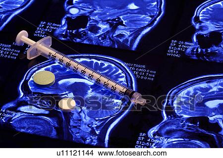 Picture - Close-up of an injection and two tablets. Fotosearch
