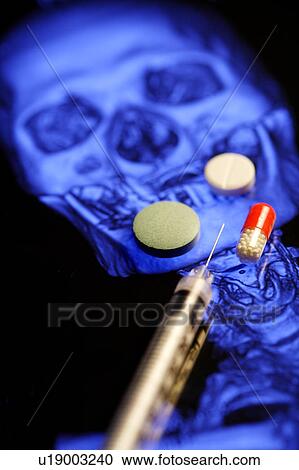 Stock Image - "Close-up of injection, tablet and capsule". Fotosearch