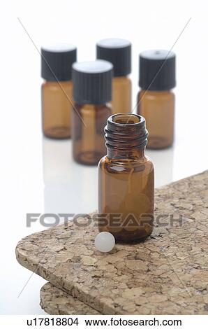 Medicine bottle and globules View Large Photo Image Picture - Medicine bottle and globules. Fotosearch