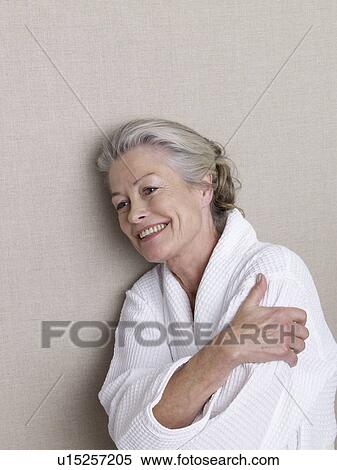 Stock Photography - Senior woman wearing bath robe. Fotosearch
