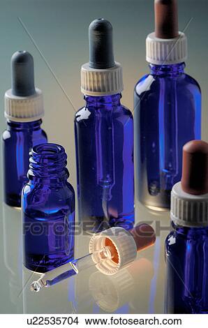 Small bottles with pipettes View Large Photo Image Picture - Small bottles with pipettes. Fotosearch