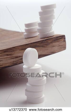Stock Image - White pills. Fotosearch