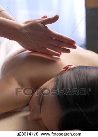 Stock Image - Woman getting massage. Fotosearch