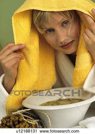 Stock Image - Woman taking a steam bath. Fotosearch