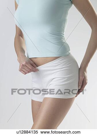 Woman wearing white shorts View Large Photo Image Stock Photography - Woman wearing white shorts. Fotosearch