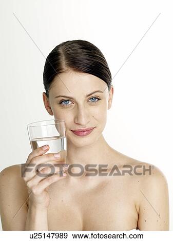 Woman with a glass of water View Large Photo Image Stock Photo - Woman with a glass of water. Fotosearch