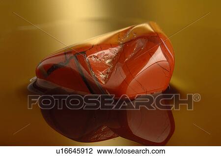 Stock Image - Healing stone red jasper. Fotosearch