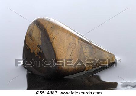Healing stone tiger's eye View Large Photo Image Stock Image - Healing stone tiger's eye. Fotosearch