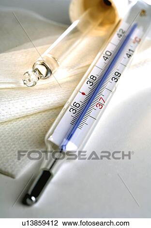 Stock Image - Clinical thermometer and pipet. Fotosearch