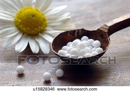 Globules and chamomilla View Large Photo Image Stock Photograph - Globules and chamomilla. Fotosearch