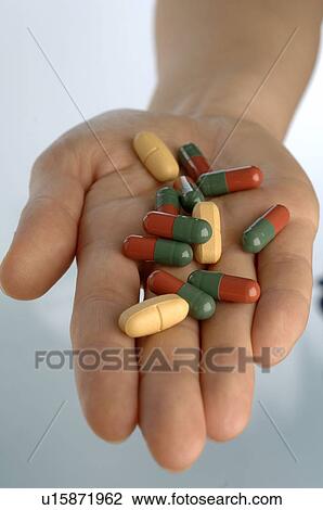 Hand holding pills View Large Photo Image Stock Image - Hand holding pills. Fotosearch