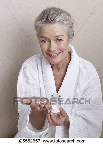 Senior lady with homeopathic crystal salts View Large Photo Image Stock Photo - Senior lady with homeopathic crystal salts. Fotosearch