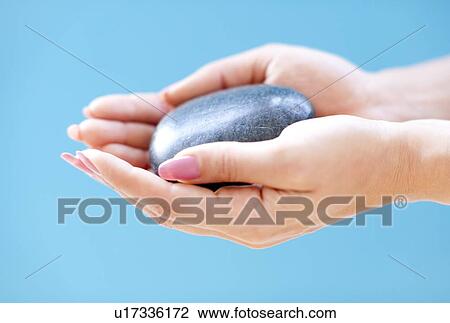 Drawing - Stone in a woman's hand. Fotosearch