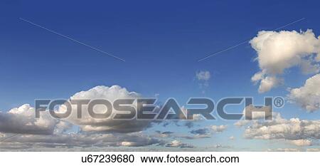 Clipart - Blue sky with cumulus clouds, artwork. Fotosearch