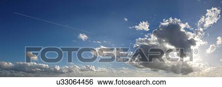 Stock Illustration - Blue sky with cumulus clouds, artwork. Fotosearch
