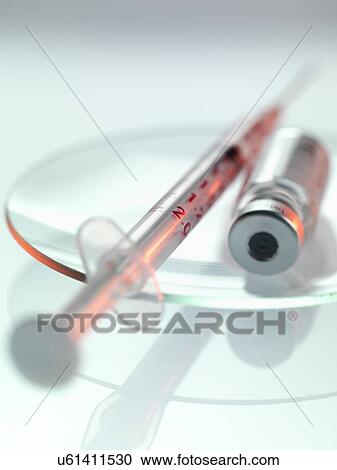 Clipart - Syringe and drug phial. Fotosearch