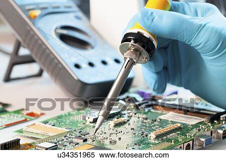 Soldering a circuit board View Large Illustration Stock Illustration - Soldering a circuit board. Fotosearch