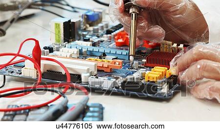 Soldering a circuit board View Large Illustration Stock Illustration - Soldering a circuit board. Fotosearch