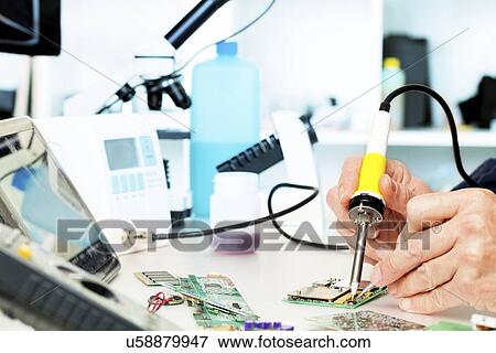 Soldering a circuit board View Large Illustration Stock Illustration - Soldering a circuit board. Fotosearch