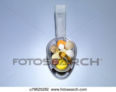 Spoonful of supplements View Large Illustration Drawing - Spoonful of supplements. Fotosearch