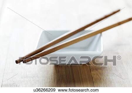 Stock Illustration - Chopsticks and bowl. Fotosearch
