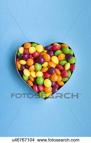 Stock Illustration - Sweets in a heart shape. Fotosearch