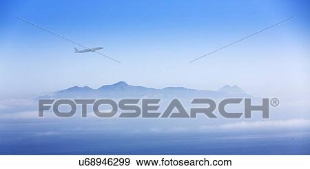 Stock Illustration - Aeroplane over mountains. Fotosearch