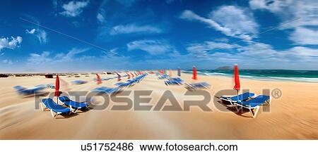 Stock Illustration - Beach with sunloungers. Fotosearch