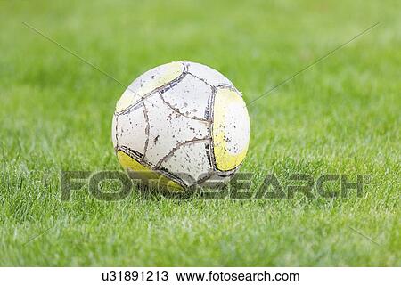 Drawing - Football on grass. Fotosearch