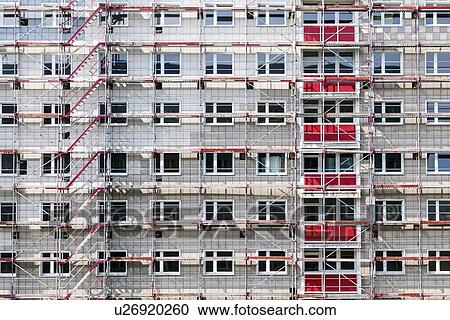 Clipart - high building house in scaffolding. Fotosearch