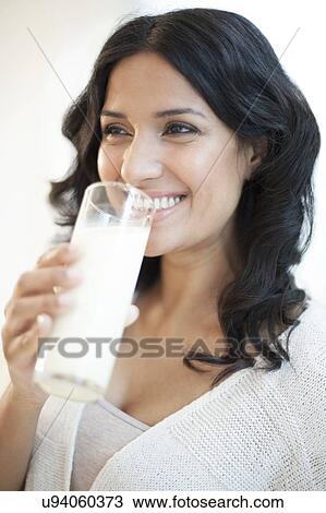 Drawing - Woman drinking milk. Fotosearch