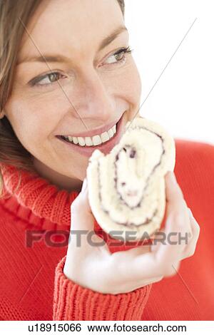 Stock Illustration - Woman eating cake. Fotosearch